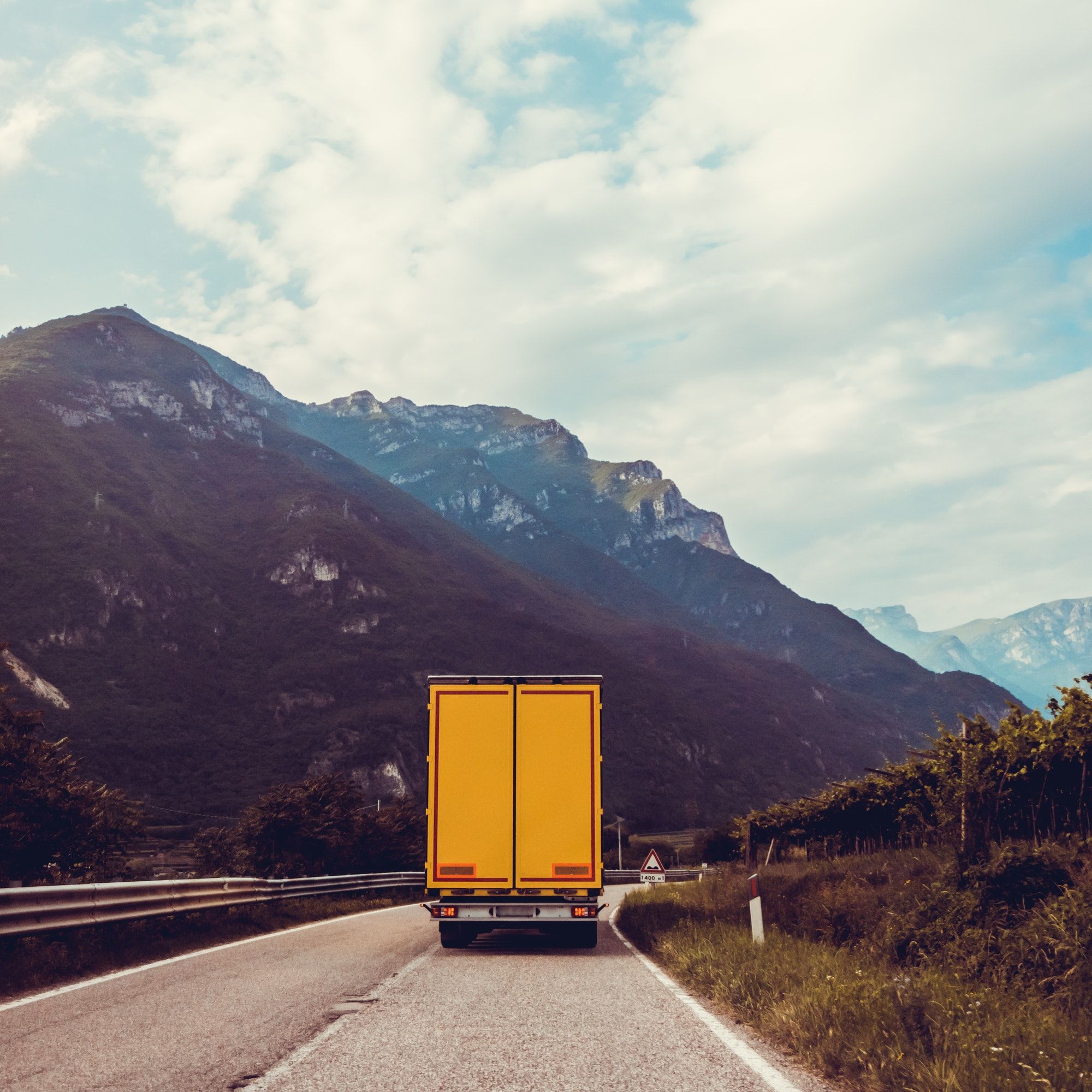 truck on the road. Yellow cargo car